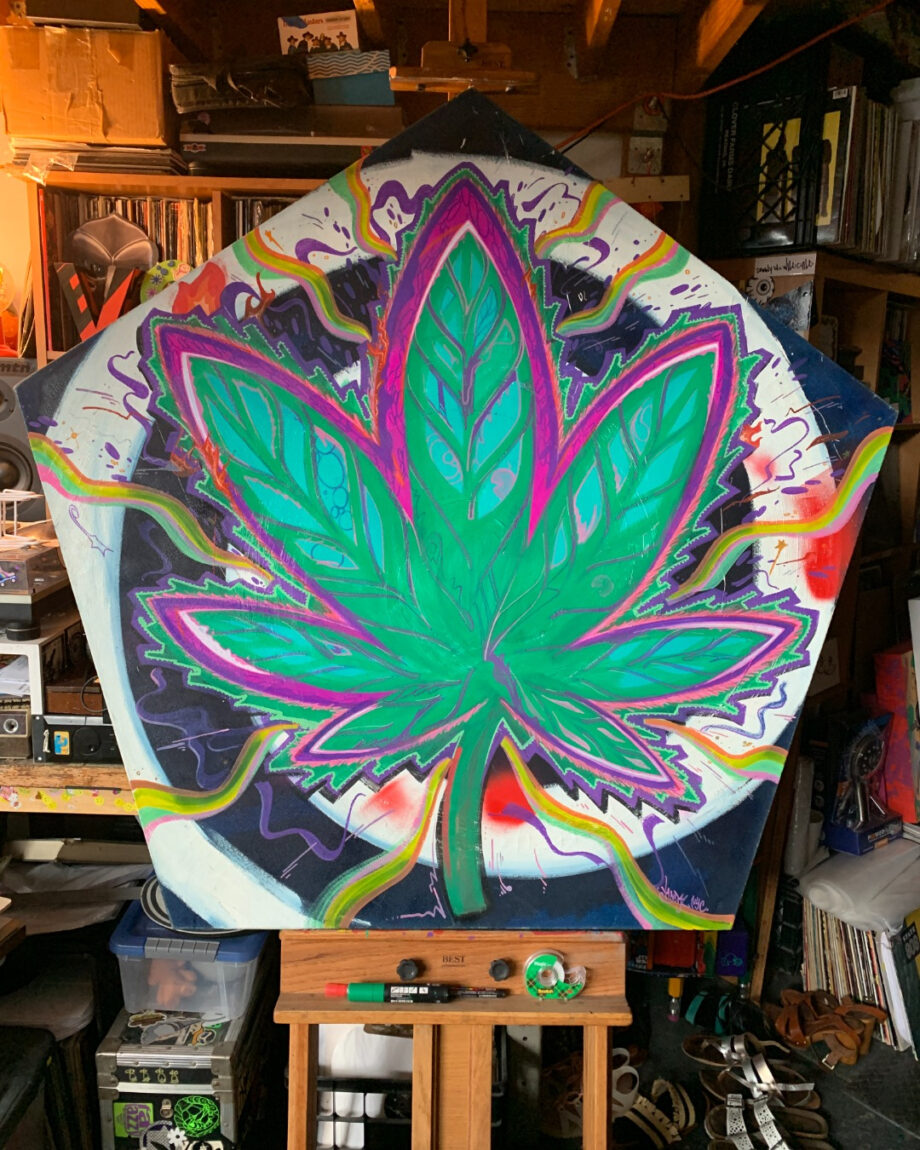 Pentagonal canvas with painted psychedelic marijuana leaf.